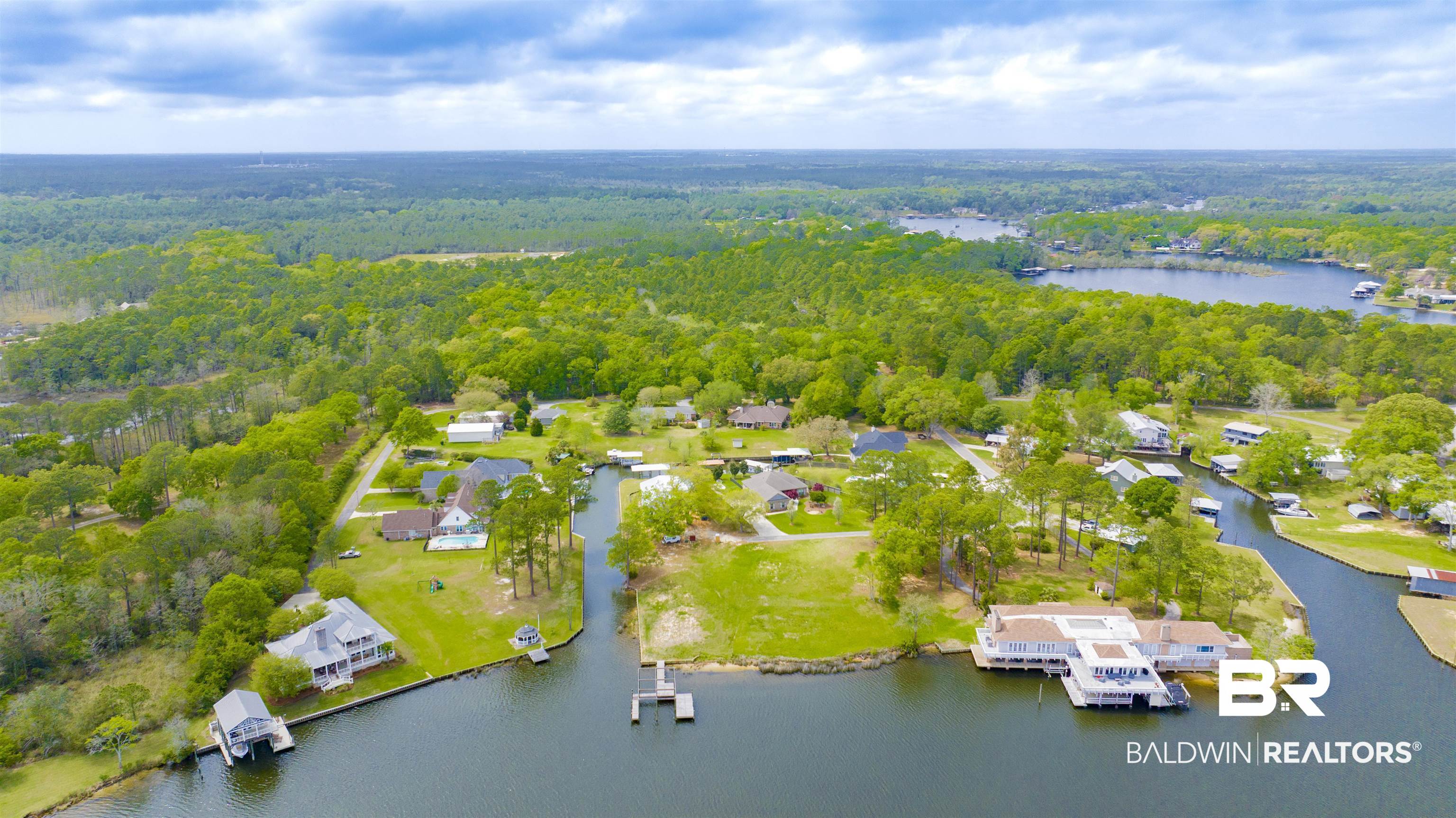 0 South Windsor Road South Theodore, AL 36582 - Photo 12 of 22 Bird's eye view of a heavily wooded area and a nearby body of water