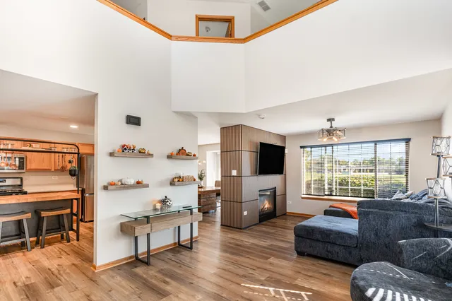 a living room with furniture fireplace and flat screen tv