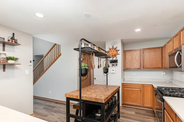 a kitchen that has a table and chairs in it