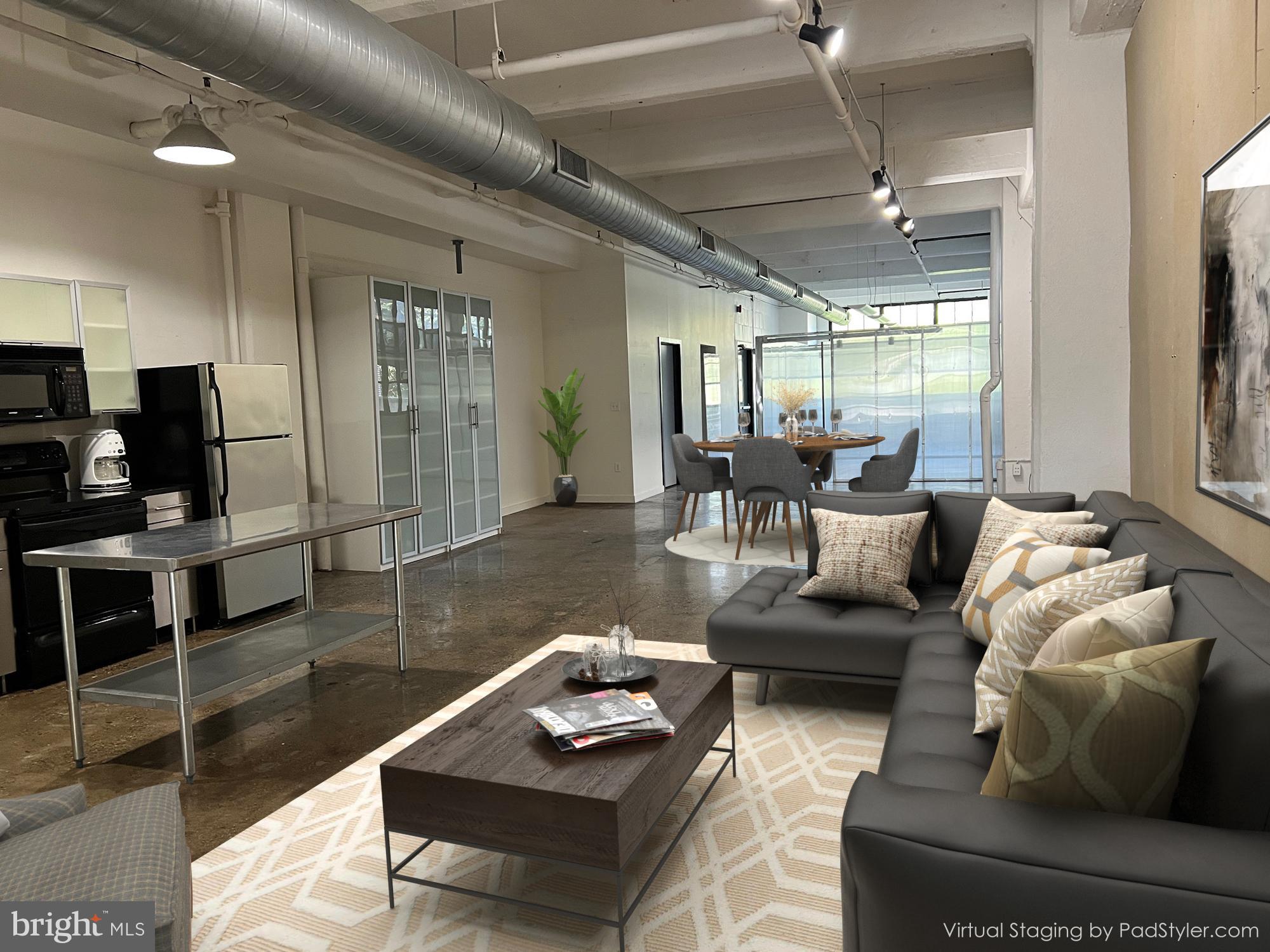 20 North 3rd Street, Unit 302 Philadelphia, PA 19106 - Photo 1 of 24 a living room with furniture and a large window