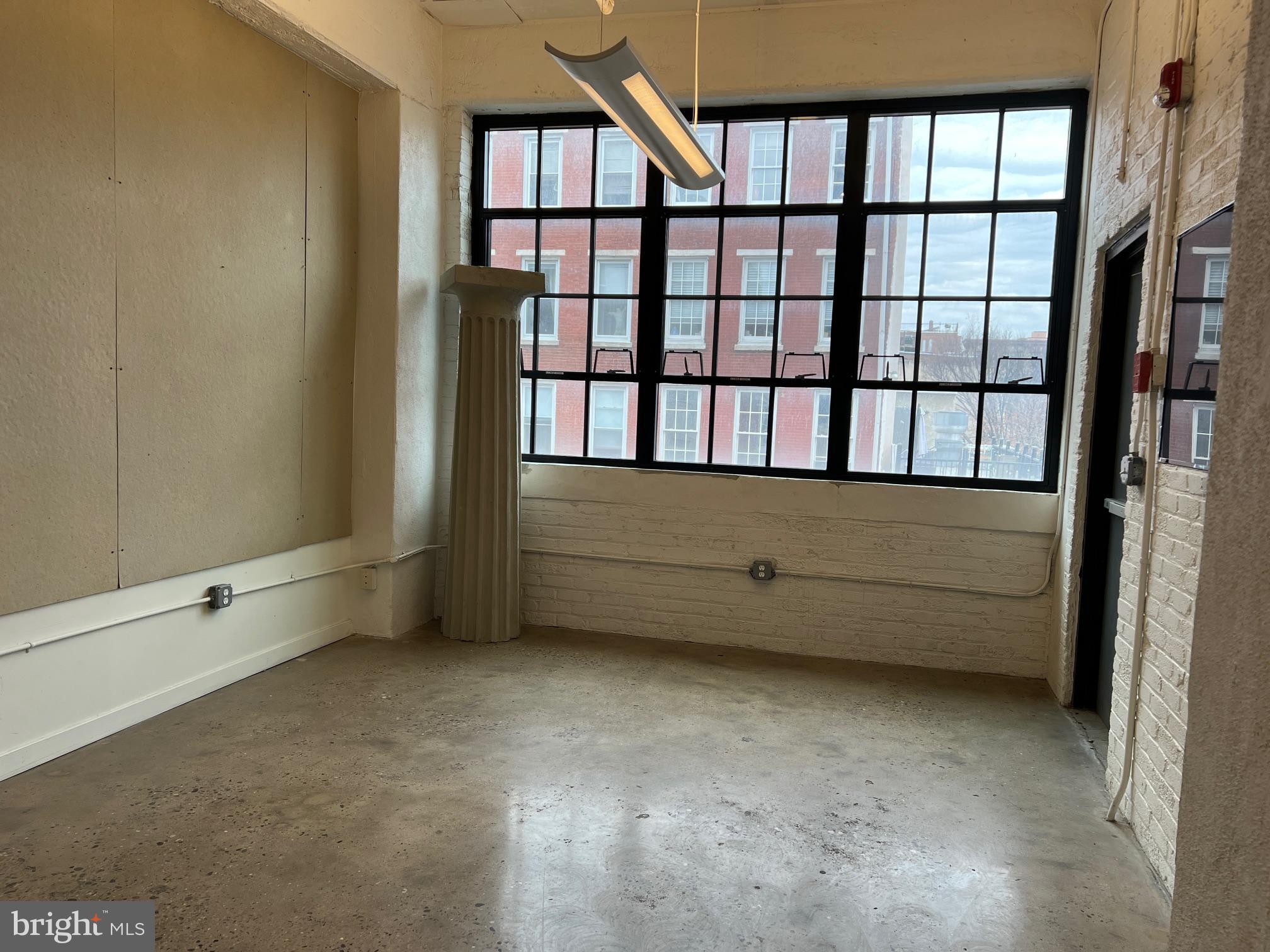 20 North 3rd Street, Unit 302 Philadelphia, PA 19106 - Photo 7 of 17 a view of an empty room with windows