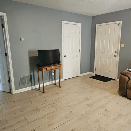a view of dining room with furniture and wooden floor