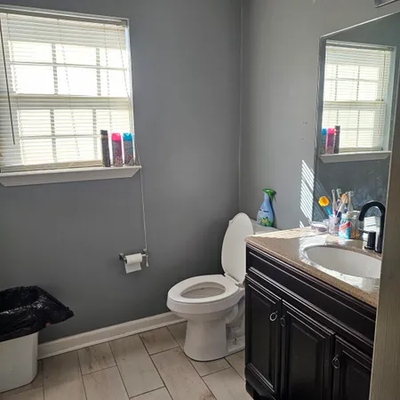 a bedroom with a bed and cabinets