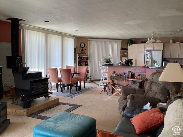 3 Red Circle, Unit 19 Manila, UT 84046 - Photo 9 of 29 Living area featuring a wood stove