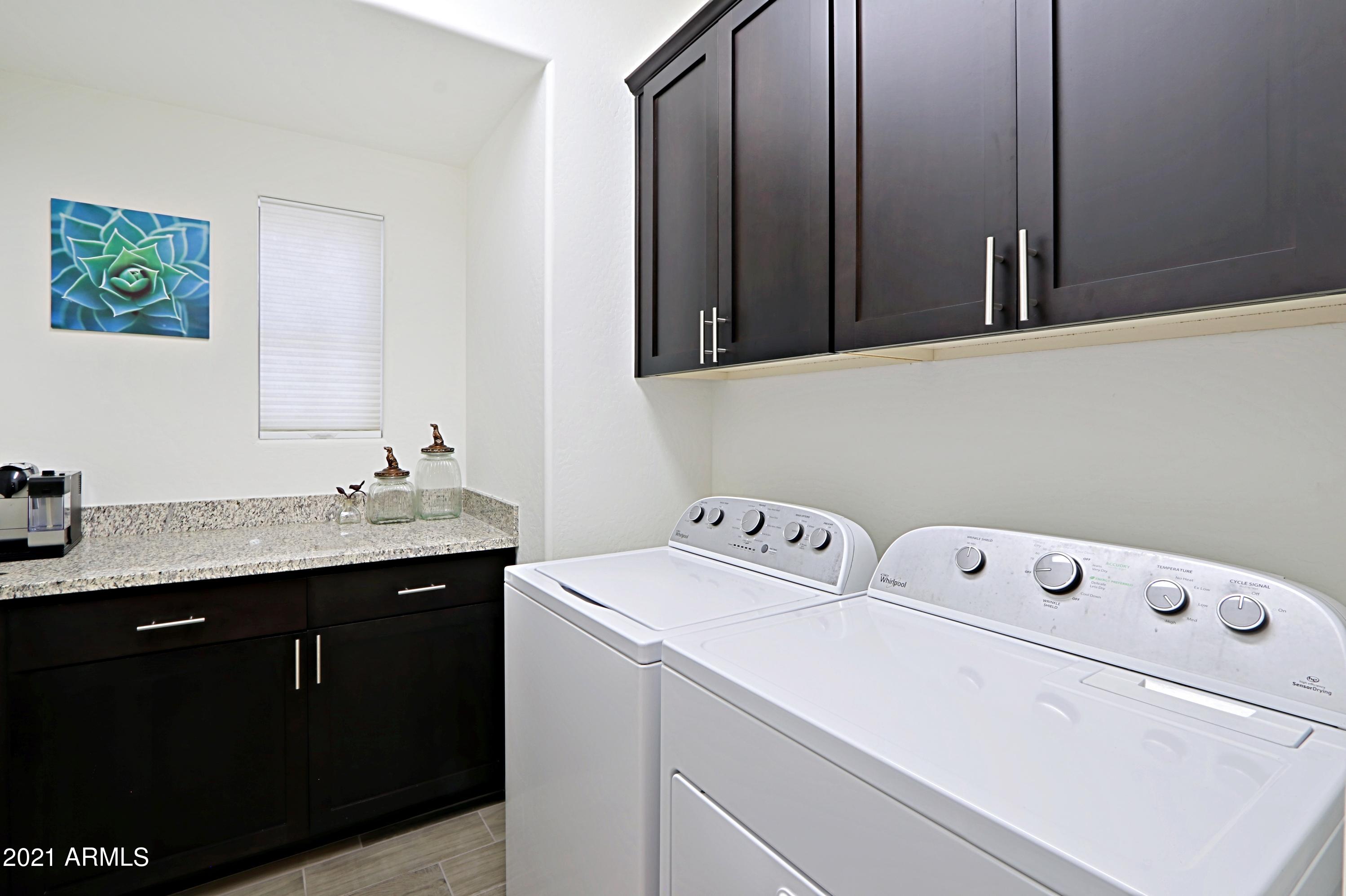 3935 East Rough Rider Road, Unit 1312 Phoenix, AZ 85050 - Photo 23 of 47 Laundry Room