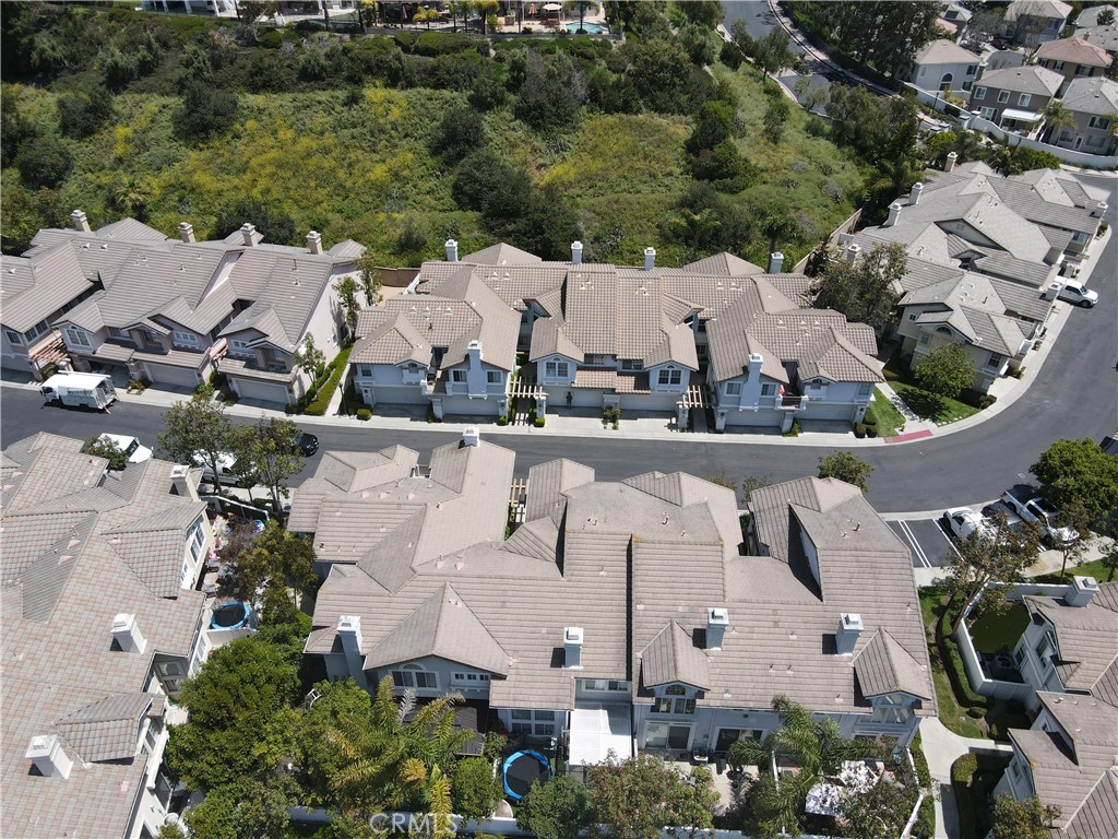 an aerial view of multiple houses with outdoor space