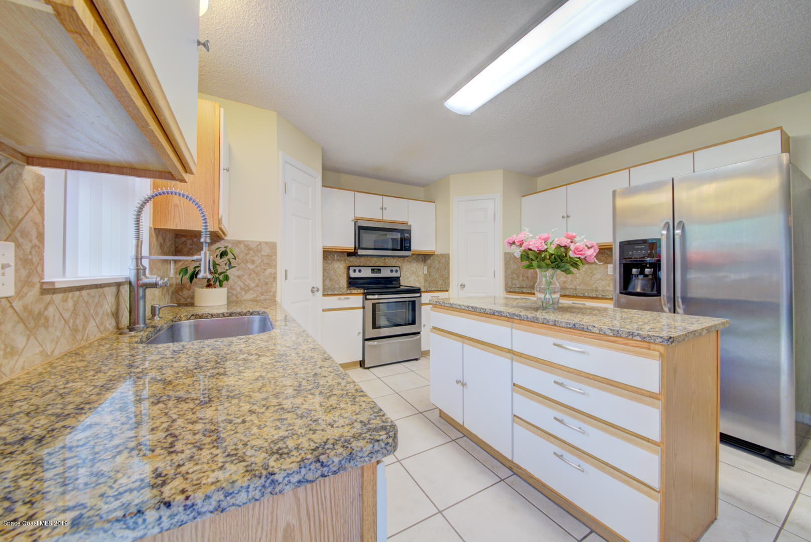 787 Raleigh Road Southeast Palm Bay, FL 32909 - Photo 11 of 51 Kitchen With Granite Countertops
