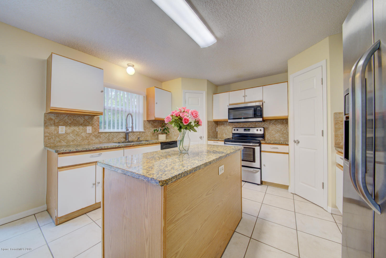 787 Raleigh Road Southeast Palm Bay, FL 32909 - Photo 13 of 51 Kitchen With Island