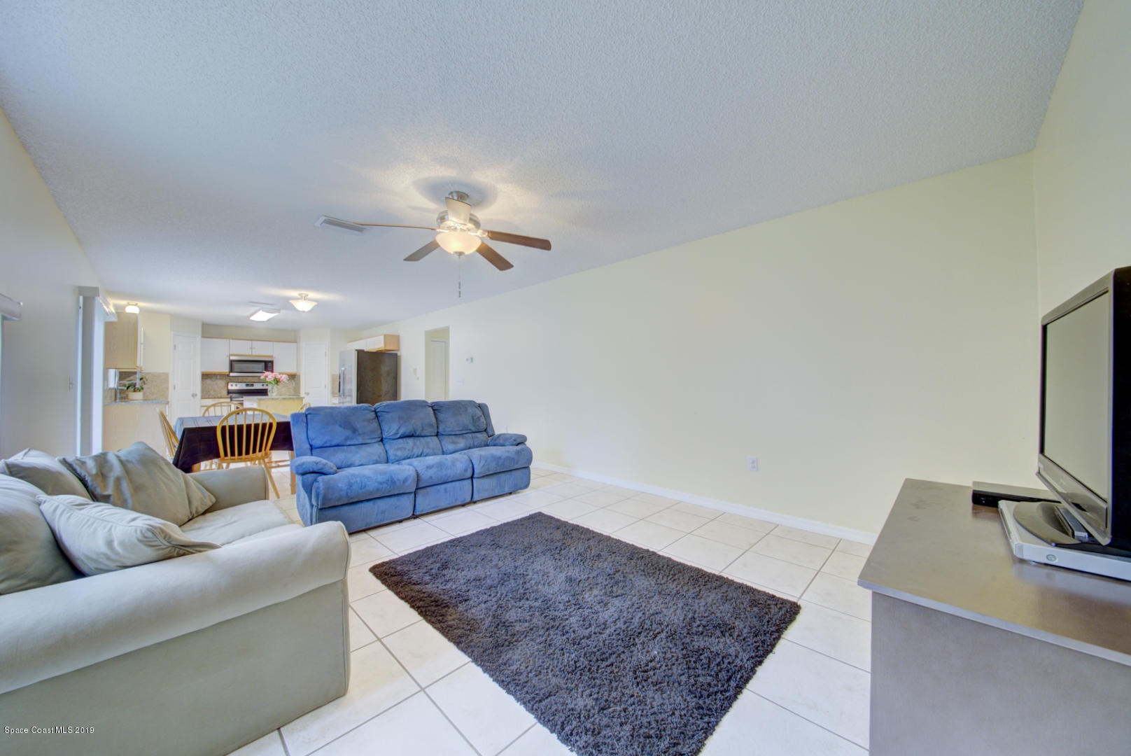 787 Raleigh Road Southeast Palm Bay, FL 32909 - Photo 18 of 51 Living Room Open to Kitchen