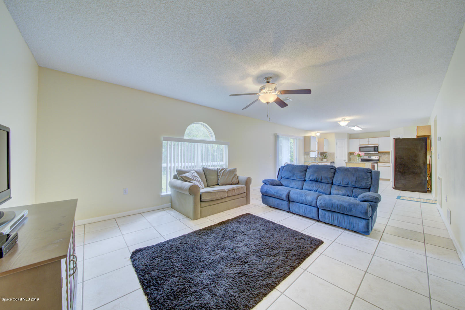 787 Raleigh Road Southeast Palm Bay, FL 32909 - Photo 20 of 51 Living Room With Tile Floor