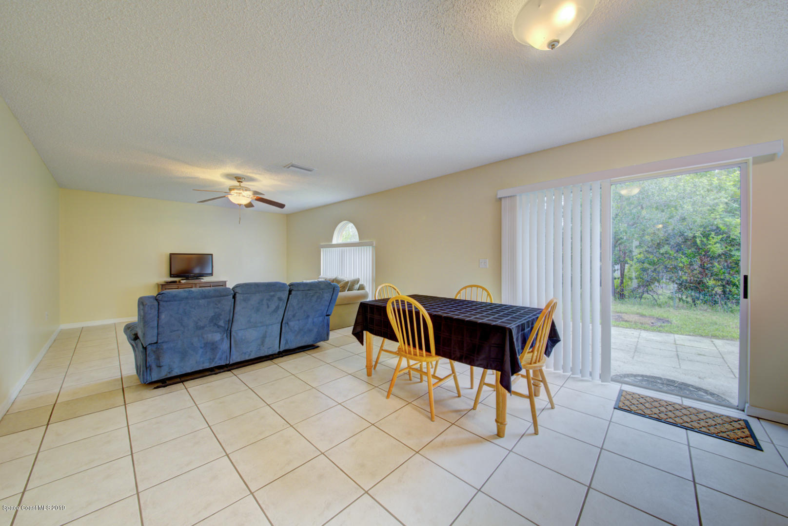 787 Raleigh Road Southeast Palm Bay, FL 32909 - Photo 21 of 51 Breakfast Area With Sliders to Backyard