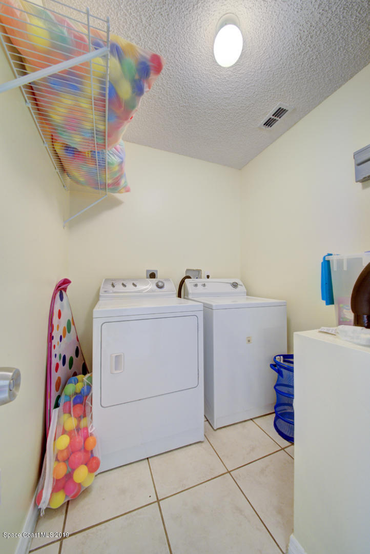 787 Raleigh Road Southeast Palm Bay, FL 32909 - Photo 22 of 51 Laundry Room