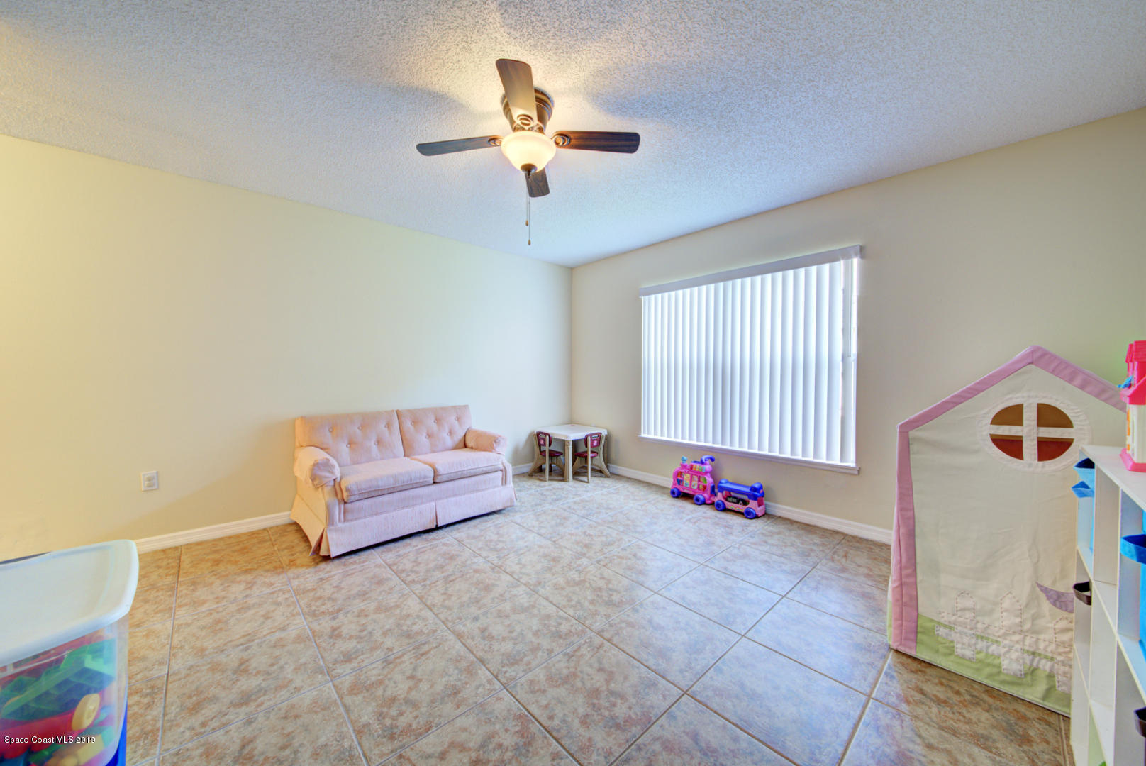 787 Raleigh Road Southeast Palm Bay, FL 32909 - Photo 24 of 51 Playroom or Office With Tile Floor