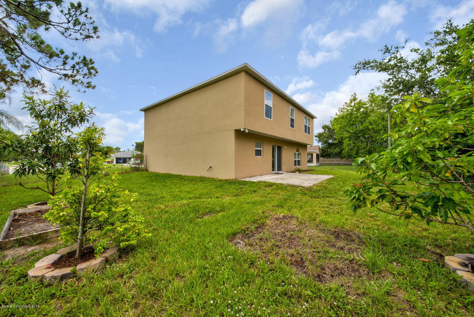 787 Raleigh Road Southeast Palm Bay, FL 32909 - Photo 46 of 51 Back of House Left