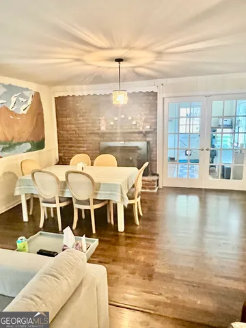 a view of a dining room with furniture wooden floor and chandelier