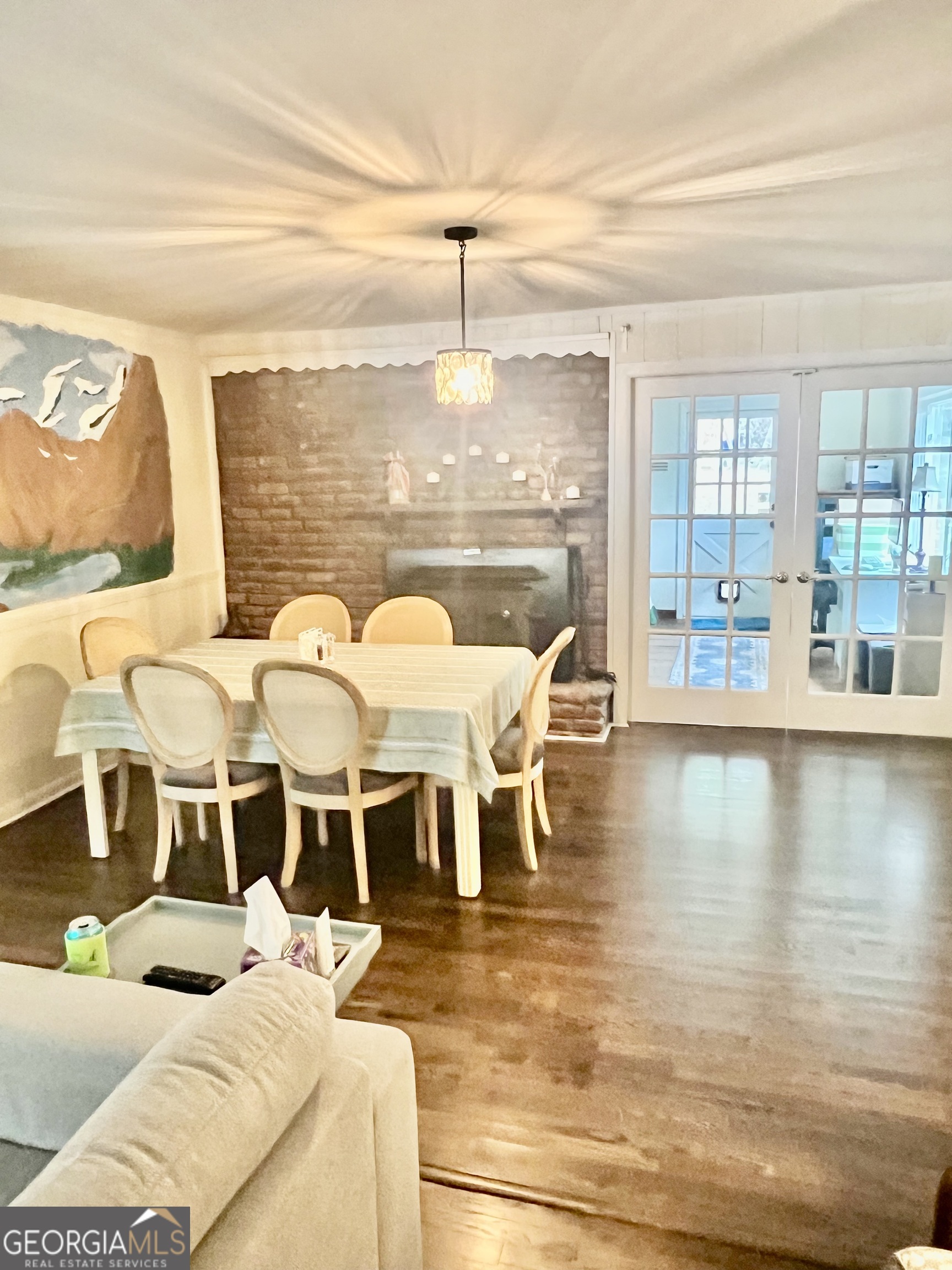 1204 Rock Chapel Road Lithonia, GA 30058 - Photo 4 of 11 a view of a dining room with furniture wooden floor and chandelier