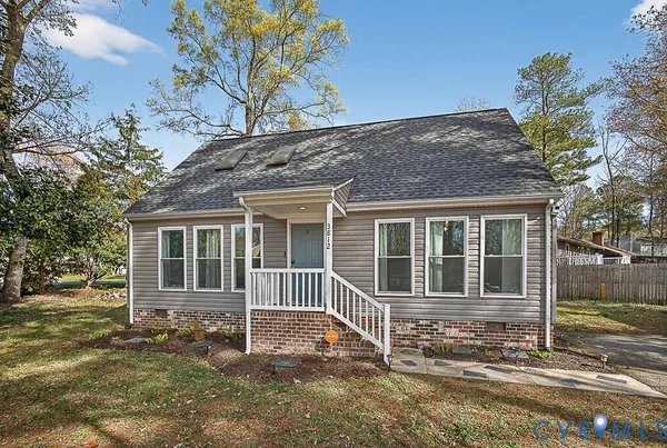a house with trees in the background