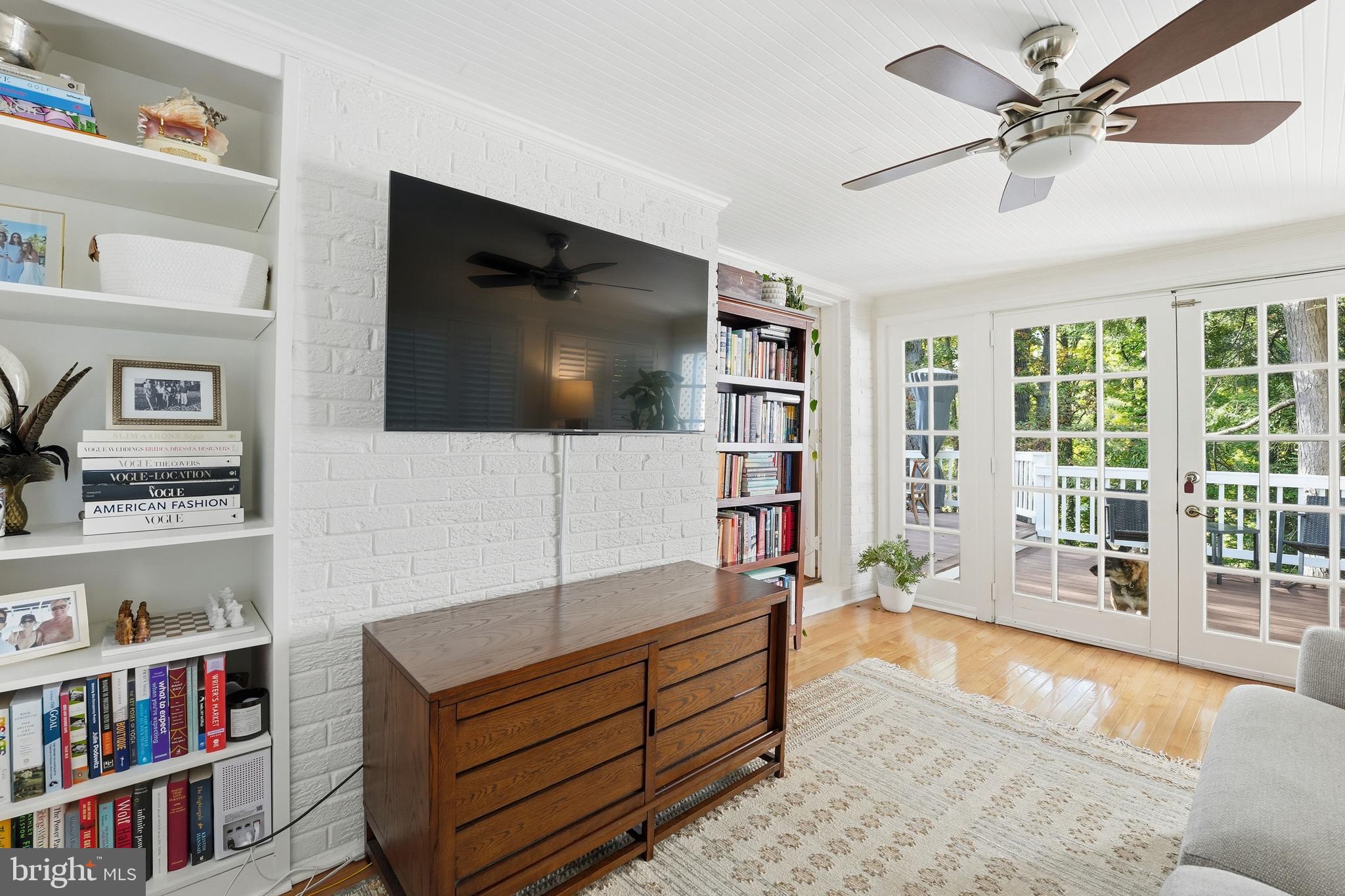 6032 Grove Drive Alexandria, VA 22307 - Photo 15 of 40 a living room with furniture and a flat screen tv