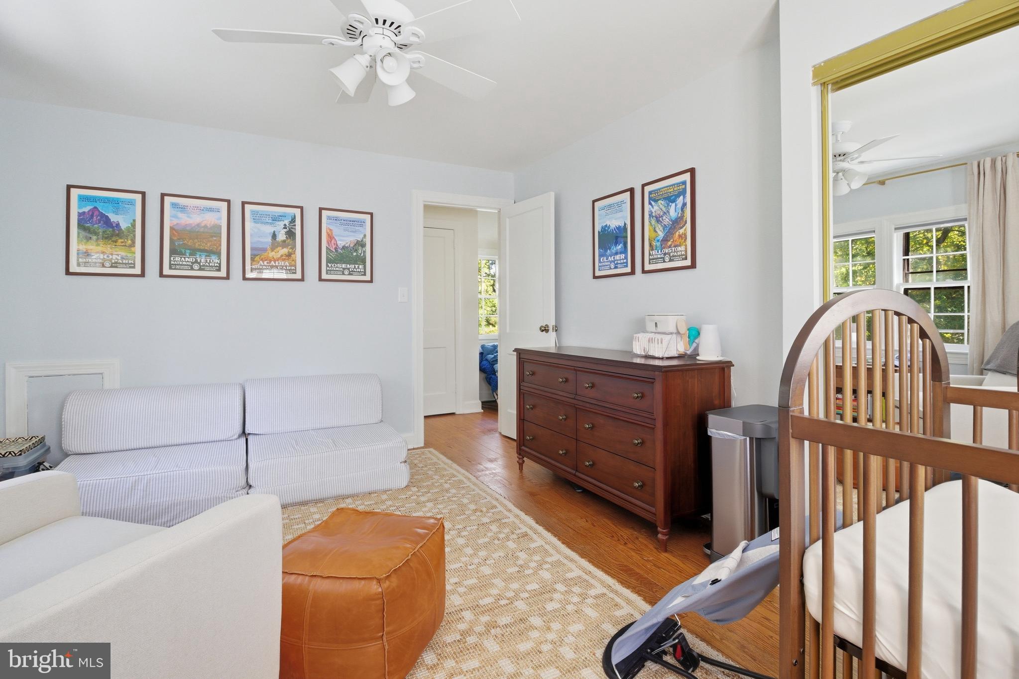 6032 Grove Drive Alexandria, VA 22307 - Photo 22 of 40 a bedroom with furniture and wooden floor