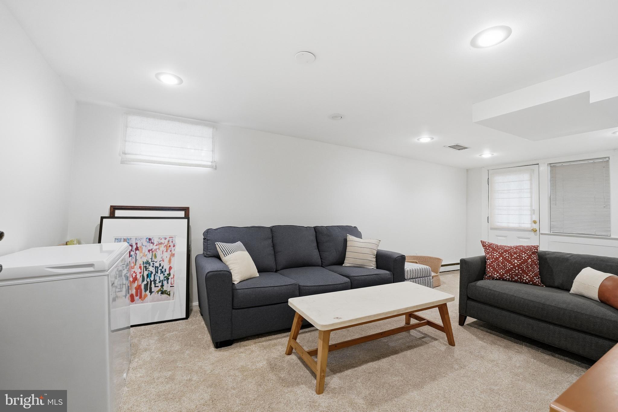 6032 Grove Drive Alexandria, VA 22307 - Photo 24 of 40 a living room with furniture and a couch