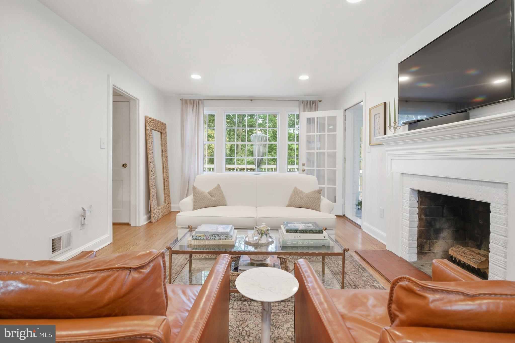 6032 Grove Drive Alexandria, VA 22307 - Photo 3 of 40 a living room with furniture and a fireplace
