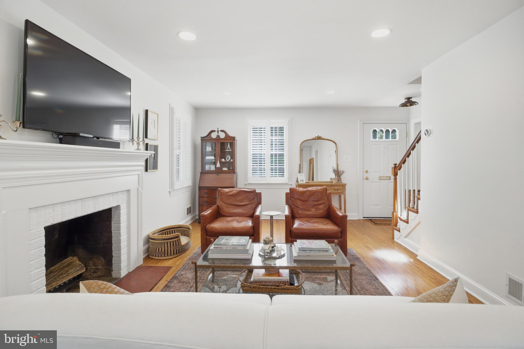 6032 Grove Drive Alexandria, VA 22307 - Photo 4 of 40 a living room with furniture fireplace and flat screen tv