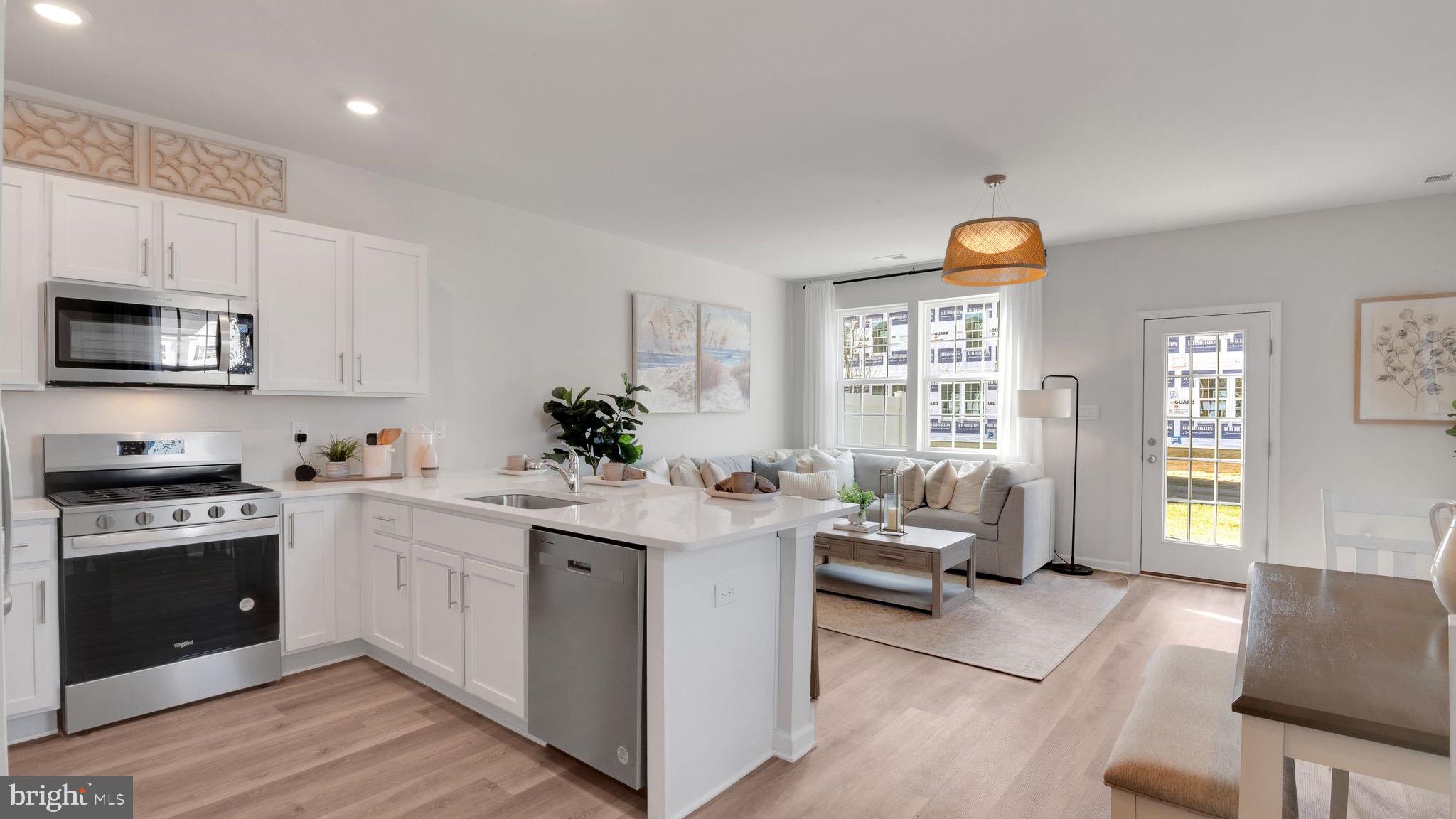 8 Whaler Drive Runnemede, NJ 08078 - Photo 8 of 24 a kitchen with a sink stove and microwave