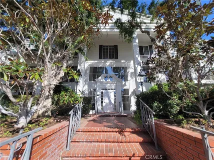 a front view of a house with a patio