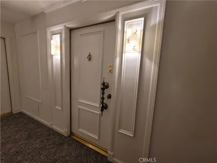 a view of a bathroom with a glass door and a window