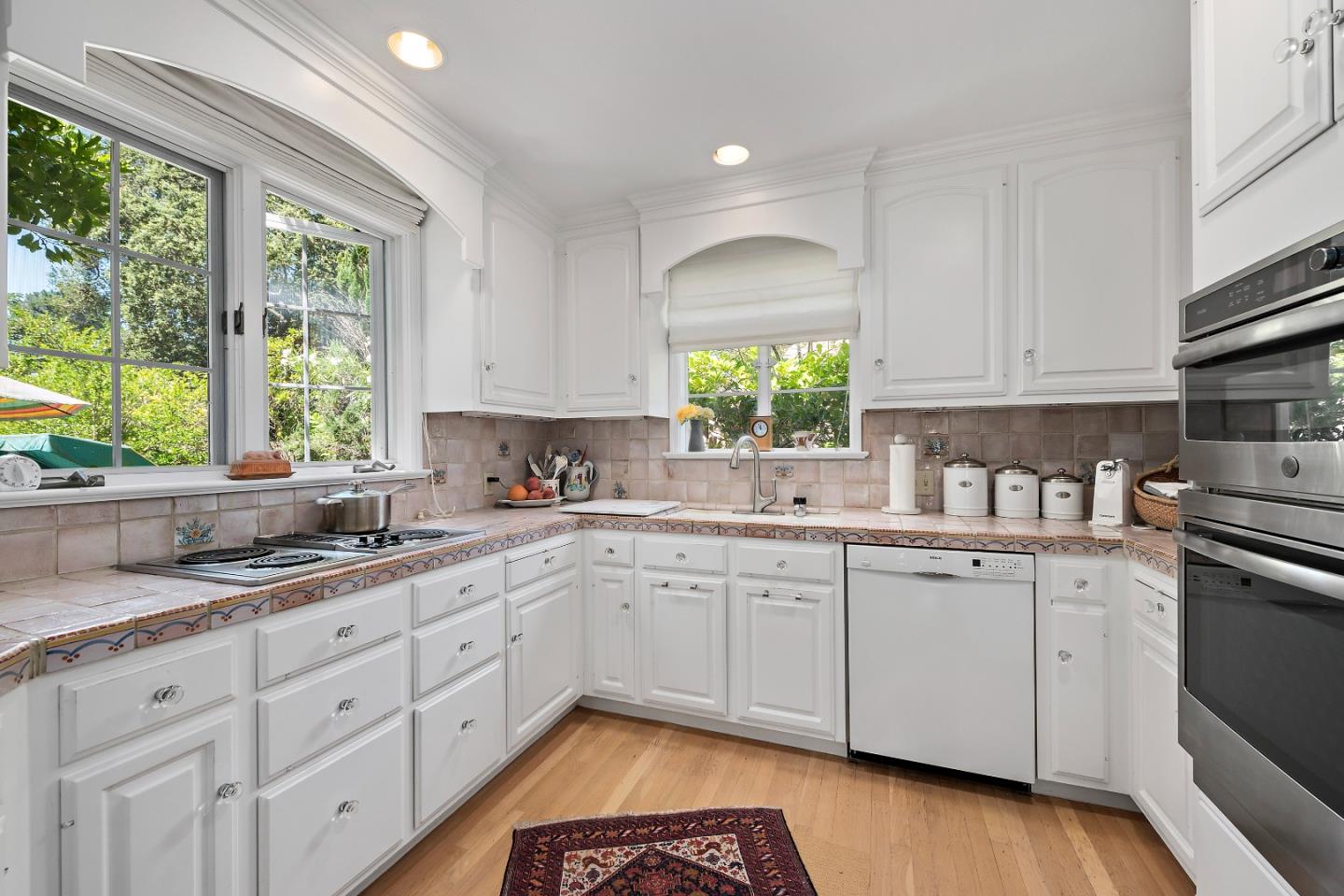 72 Winchester Drive Atherton, CA 94027 - Photo 11 of 50 a kitchen with a sink window and cabinets