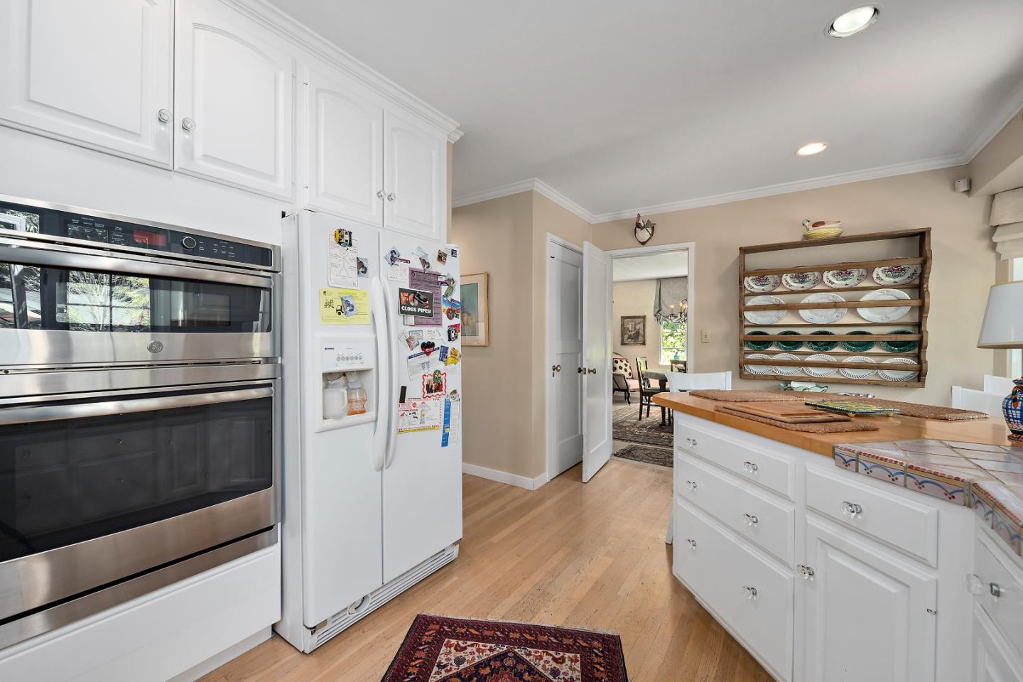 72 Winchester Drive Atherton, CA 94027 - Photo 12 of 50 a kitchen with stainless steel appliances white cabinets and a refrigerator
