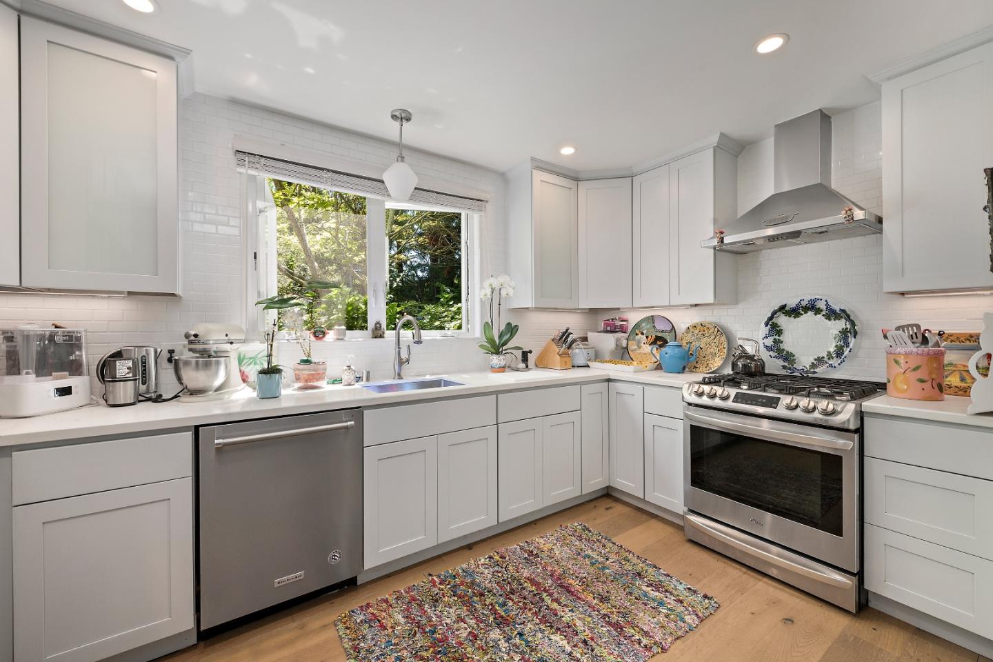 72 Winchester Drive Atherton, CA 94027 - Photo 13 of 50 a kitchen with a stove sink and cabinets