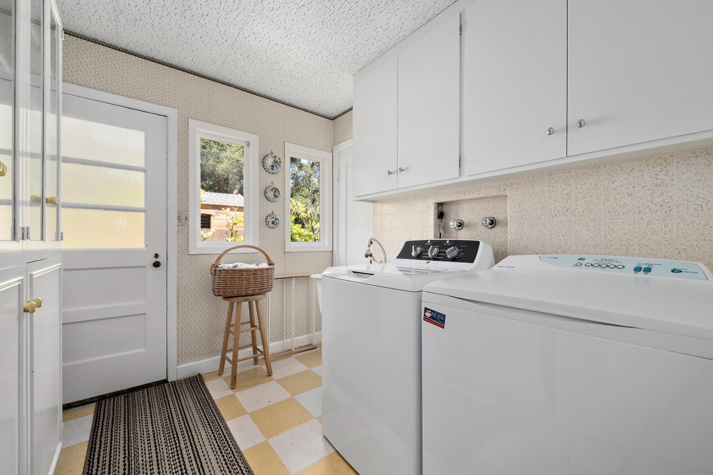 72 Winchester Drive Atherton, CA 94027 - Photo 20 of 50 a utility room with cabinets washer and dryer