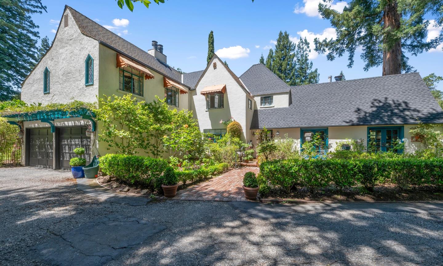 72 Winchester Drive Atherton, CA 94027 - Photo 3 of 50 a front view of a house with a yard and potted plants