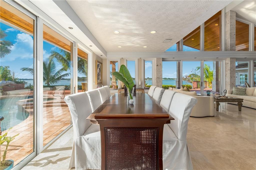 137 South River Road Stuart, FL 34996 - Photo 13 of 55 a view of a dining room with furniture window and wooden floor