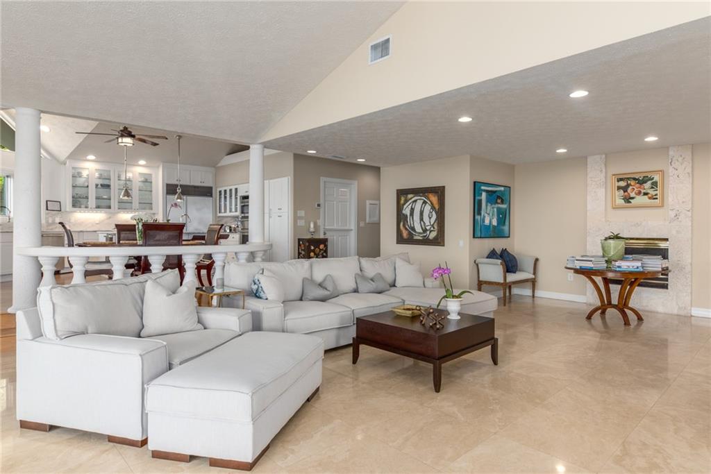 137 South River Road Stuart, FL 34996 - Photo 16 of 55 a living room with furniture and a large window
