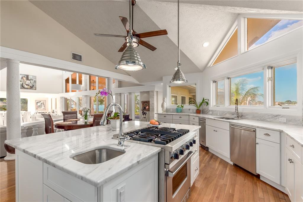 137 South River Road Stuart, FL 34996 - Photo 19 of 55 a kitchen with stainless steel appliances granite countertop a sink and stove