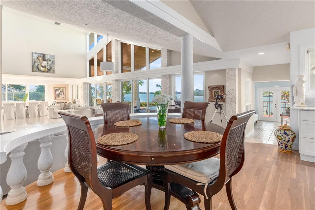 137 South River Road Stuart, FL 34996 - Photo 20 of 55 a view of a dining room with furniture and wooden floor