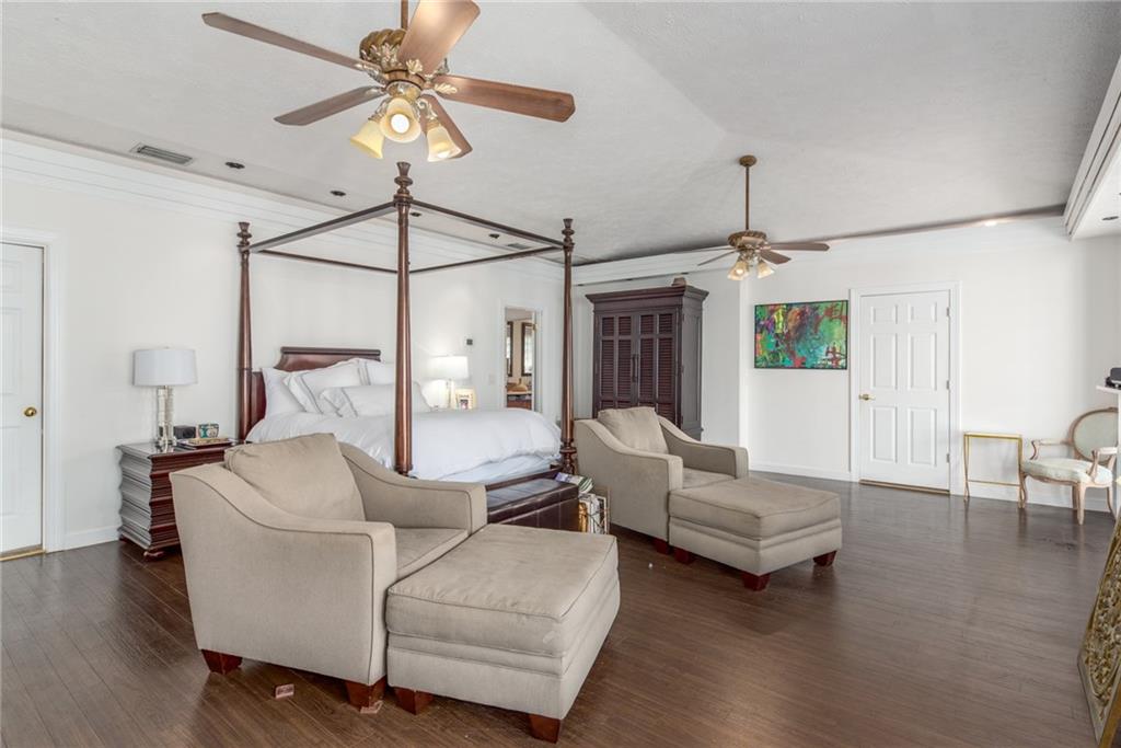 137 South River Road Stuart, FL 34996 - Photo 21 of 55 a living room with furniture and a chandelier