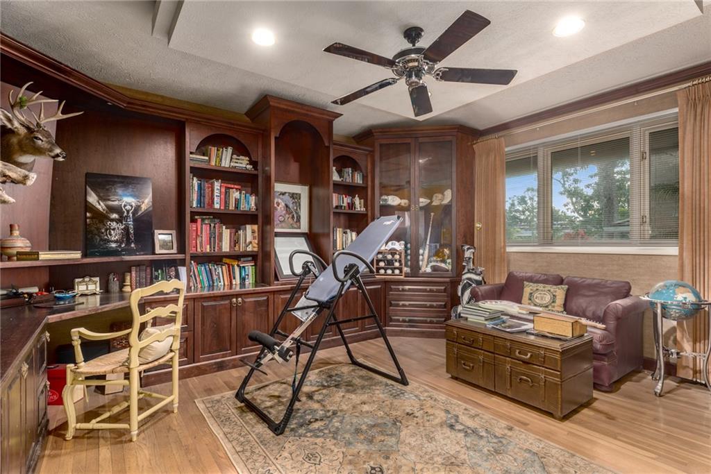 137 South River Road Stuart, FL 34996 - Photo 28 of 55 a living room with furniture a bookshelf and a window