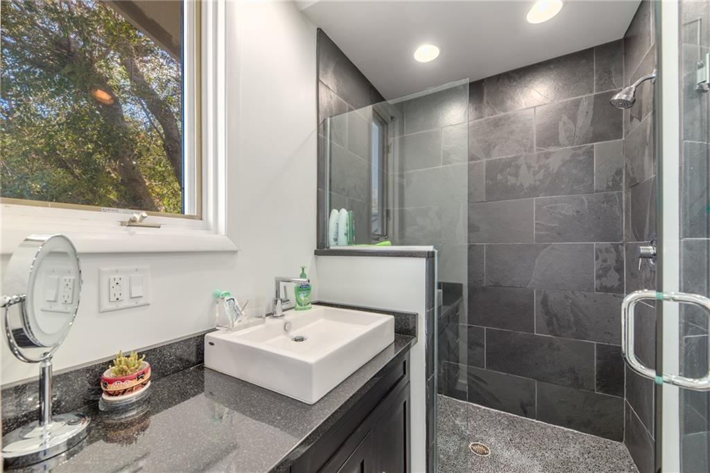 137 South River Road Stuart, FL 34996 - Photo 31 of 55 a bathroom with a sink toilet and shower