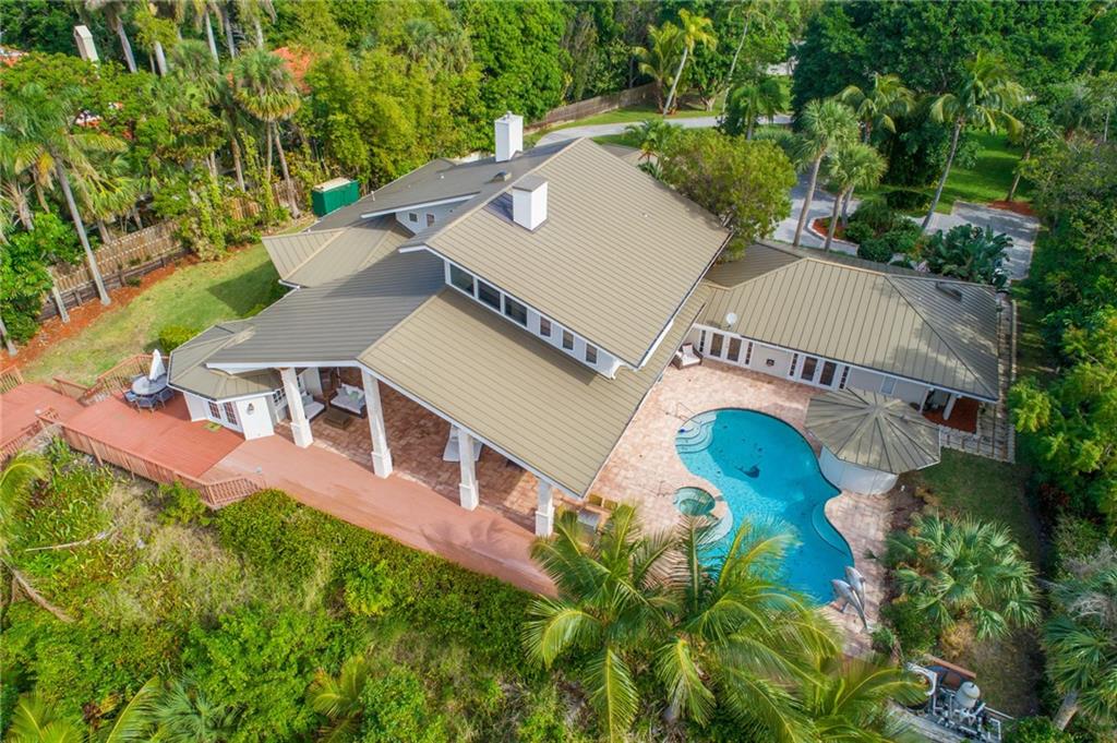137 South River Road Stuart, FL 34996 - Photo 4 of 55 an aerial view of a house with swimming pool and outdoor space