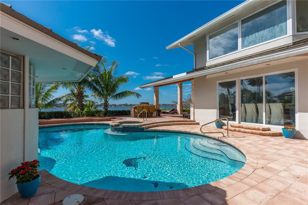 137 South River Road Stuart, FL 34996 - Photo 45 of 55 a view of a swimming pool with a patio