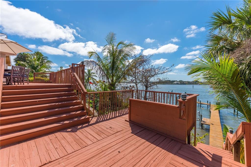 137 South River Road Stuart, FL 34996 - Photo 46 of 55 a view of balcony with wooden floor and outdoor seating