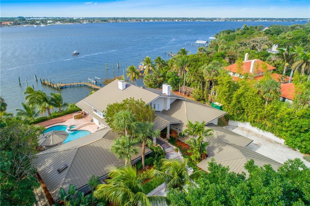 137 South River Road Stuart, FL 34996 - Photo 49 of 55 an aerial view of a house with a garden and lake view
