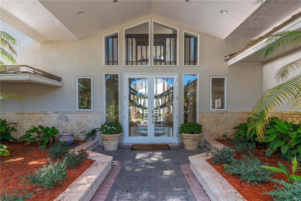 137 South River Road Stuart, FL 34996 - Photo 8 of 55 a view of a house with a potted plant