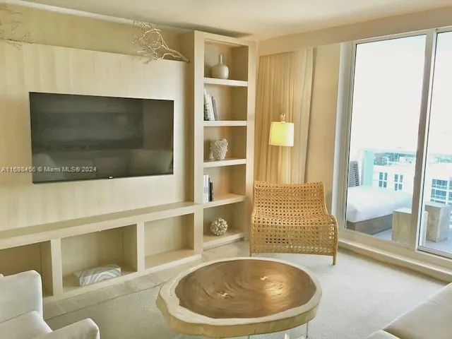 a kitchen with stainless steel appliances granite countertop a sink and a stove