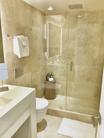 a bedroom with a bed and a mirror