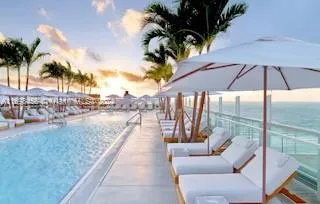 a terrace with outdoor seating and city view