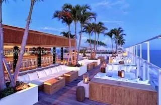 a view of a chairs and table in a room